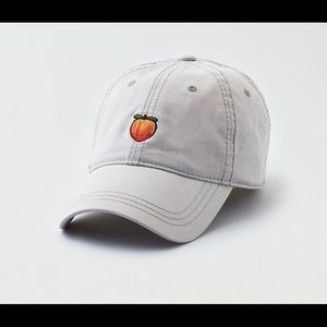 an american eagle hat with a peach on it